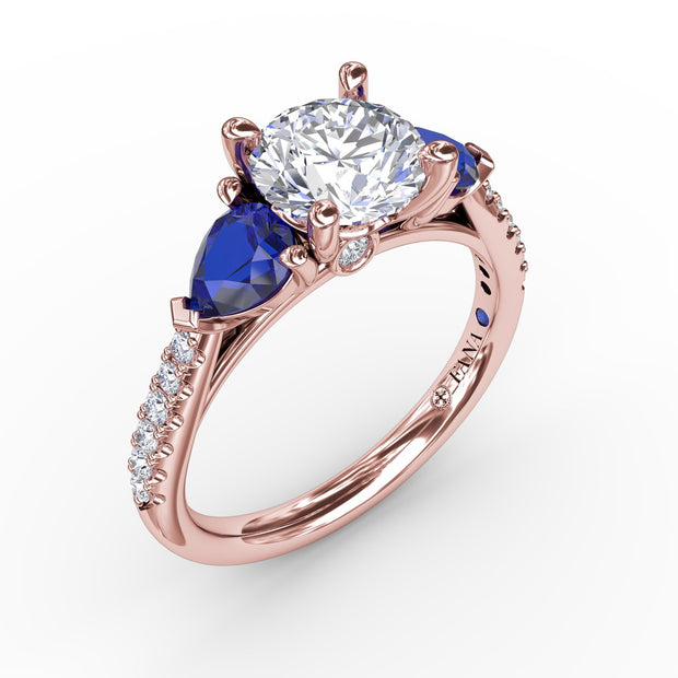 Elegant Pear Sidestone Ring in Sapphire