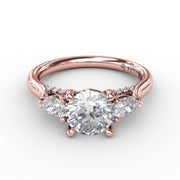 Classic Three-Stone Diamond Engagement Ring With Pear-Shape Side Diamonds
