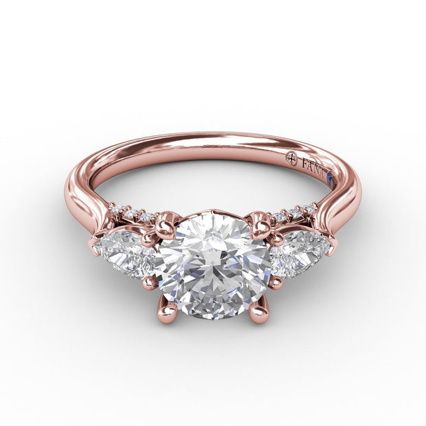 Classic Three-Stone Diamond Engagement Ring With Pear-Shape Side Diamonds