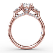 Classic Three-Stone Diamond Engagement Ring With Pear-Shape Side Diamonds