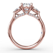 Classic Three-Stone Diamond Engagement Ring With Pear-Shape Side Diamonds