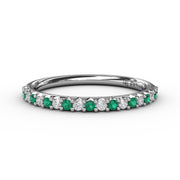 Delicate Emerald Shared Prong Anniversary Band