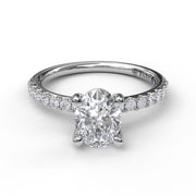 Classic Single Row Engagement ring with an Oval Center Diamond.